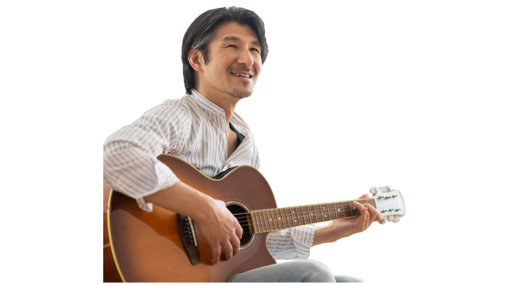 Man playing guitar with a smile