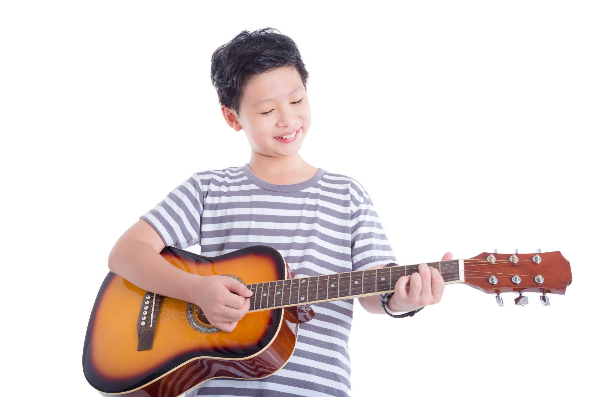 Kid playing guitar and having fun