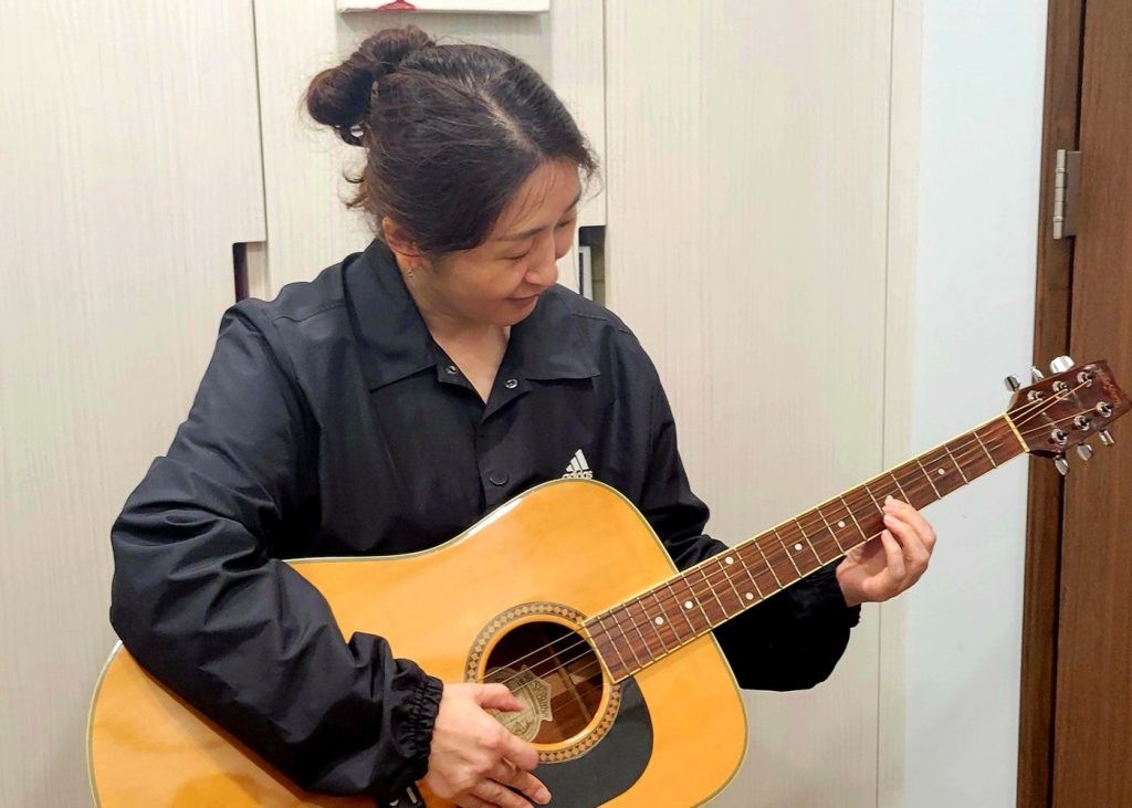 Student Playing Guitar
