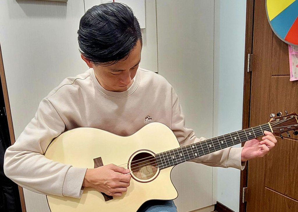 Student Playing Guitar