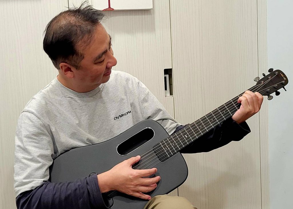 Student Playing Guitar