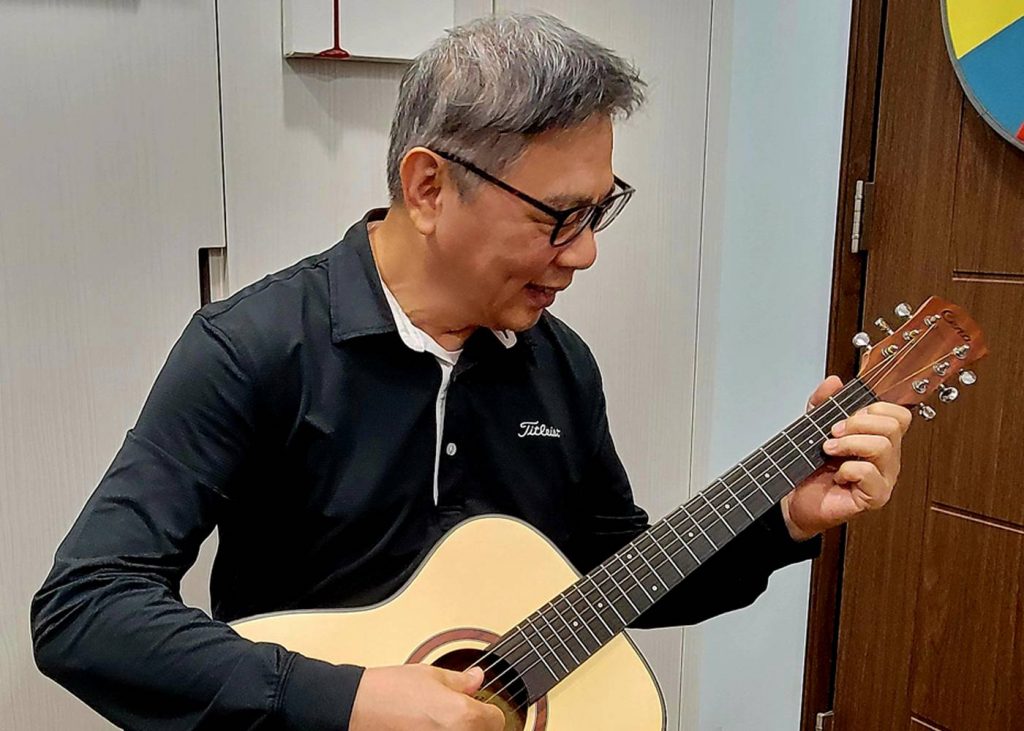 Student Playing Guitar