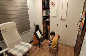 Kid having fun playing guitar