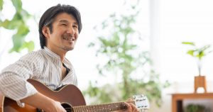 Happy Man Playing Guitar